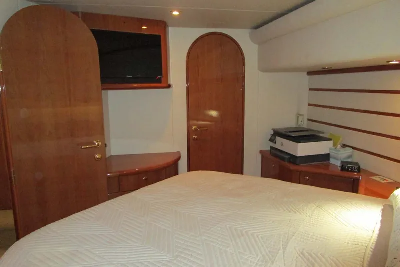 Slide: The Image of Luxurious cabin interior of 2006 Neptunus 56 Flybridge yacht with wood accents and modern amenities. - 21