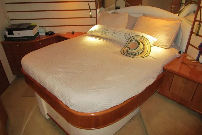 Slide: The Image of Luxurious bedroom interior of 2006 Neptunus 56 Flybridge yacht with elegant bedding. - 20