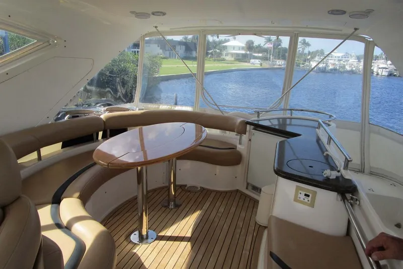 Slide: The Image of Luxurious 2006 Neptunus 56 Flybridge interior with elegant seating and scenic water view. - 69
