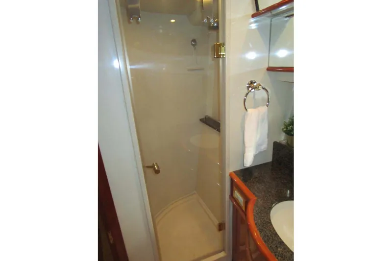 Slide: The Image of Luxurious bathroom in 2006 Neptunus 56 Flybridge yacht with glass shower enclosure. - 25