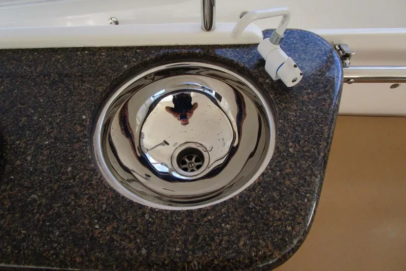 Slide: The Image of Granite countertop with a stainless steel sink on a 2006 Neptunus 56 Flybridge yacht. - 63