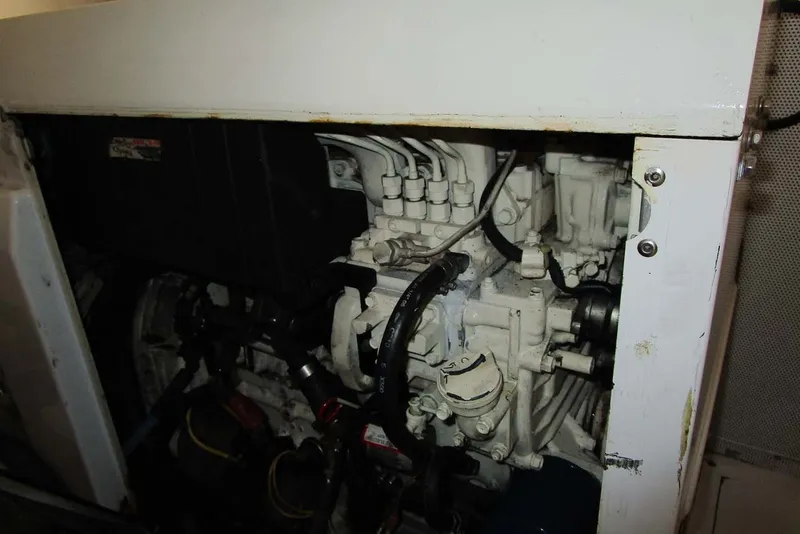 Slide: The Image of Engine compartment of a 2006 Neptunus 56 Flybridge yacht, showcasing mechanical components. - 75