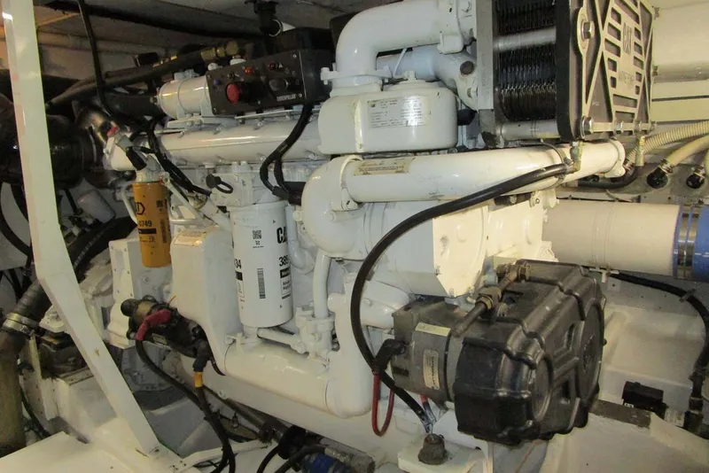 Slide: The Image of Engine room of a 2006 Neptunus 56 Flybridge yacht, showcasing mechanical components. - 73