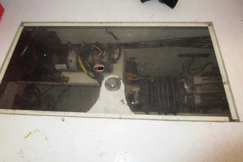 Slide: The Image of Engine compartment of a 2006 Neptunus 56 Flybridge yacht, showcasing mechanical components. - 80
