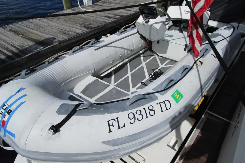 Slide: The Image of Inflatable boat docked beside a Neptunus 56 Flybridge, 2006 model. - 52