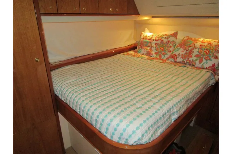 Slide: The Image of Cozy bedroom in 2006 Neptunus 56 Flybridge yacht with patterned bedding. - 27