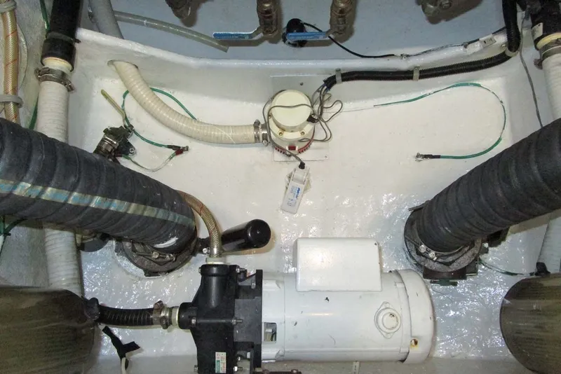 Slide: The Image of Engine room of 2006 Neptunus 56 Flybridge yacht, showcasing mechanical components and piping. - 77