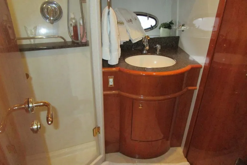 Slide: The Image of Luxurious bathroom in 2006 Neptunus 56 Flybridge yacht with elegant wood cabinetry. - 33