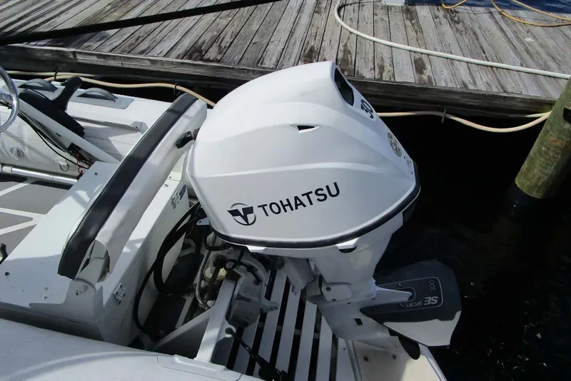 Slide: The Image of Tohatsu outboard motor on a 2006 Neptunus 56 Flybridge yacht at dock. - 53