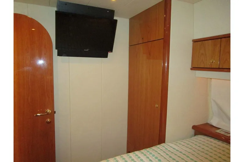 Slide: The Image of Interior of 2006 Neptunus 56 Flybridge yacht cabin with TV and wooden cabinetry. - 30
