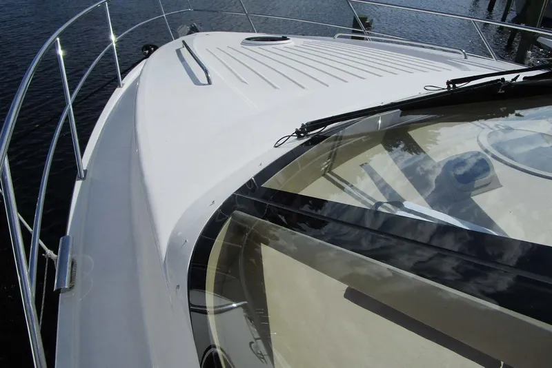 Slide: The Image of 2006 Neptunus 56 Flybridge yacht deck with sleek design and stainless steel railings. - 37