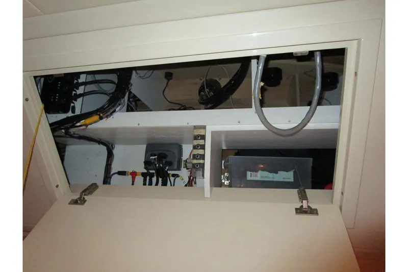Slide: The Image of Electrical compartment of a 2006 Neptunus 56 Flybridge yacht, showcasing wiring and components. - 29