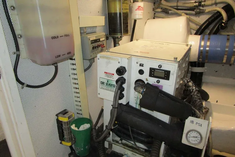 Slide: The Image of Engine room of 2006 Neptunus 56 Flybridge yacht with mechanical equipment and gauges. - 76