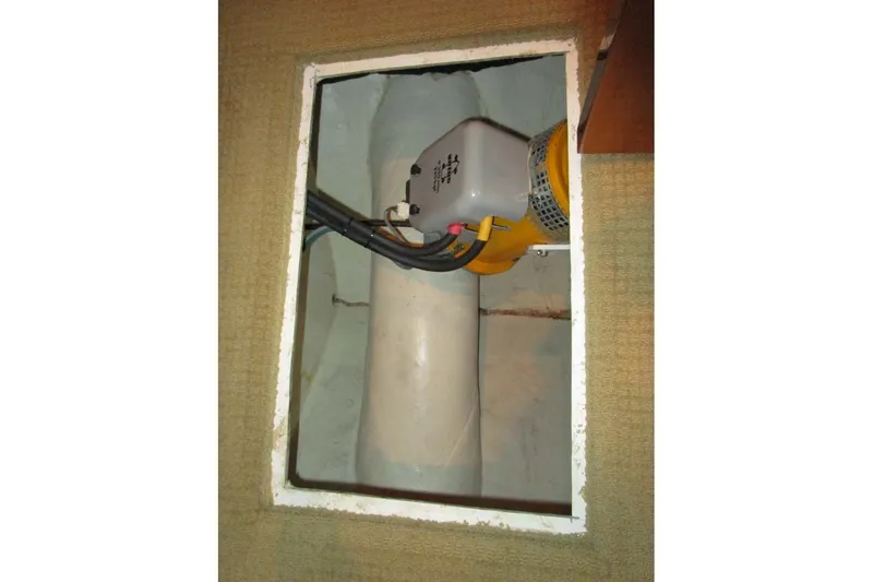 Slide: The Image of Engine compartment of a 2006 Neptunus 56 Flybridge yacht, showing mechanical components. - 36