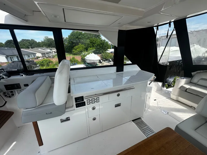 Slide: The Image of Interior of a 2021 Regal 36 Grande Coupe with sleek white furnishings. - 19