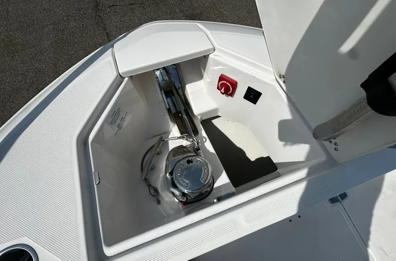 Slide: The Image of Anchor locker of the 2021 Regal 36 Grande Coupe with windlass and controls. - 9