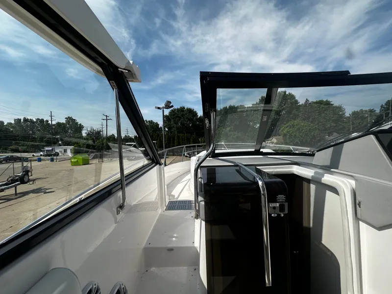 Slide: The Image of The image shows the deck of a 2021 Regal 36 Grande Coupe with sleek lines and modern details. - 7