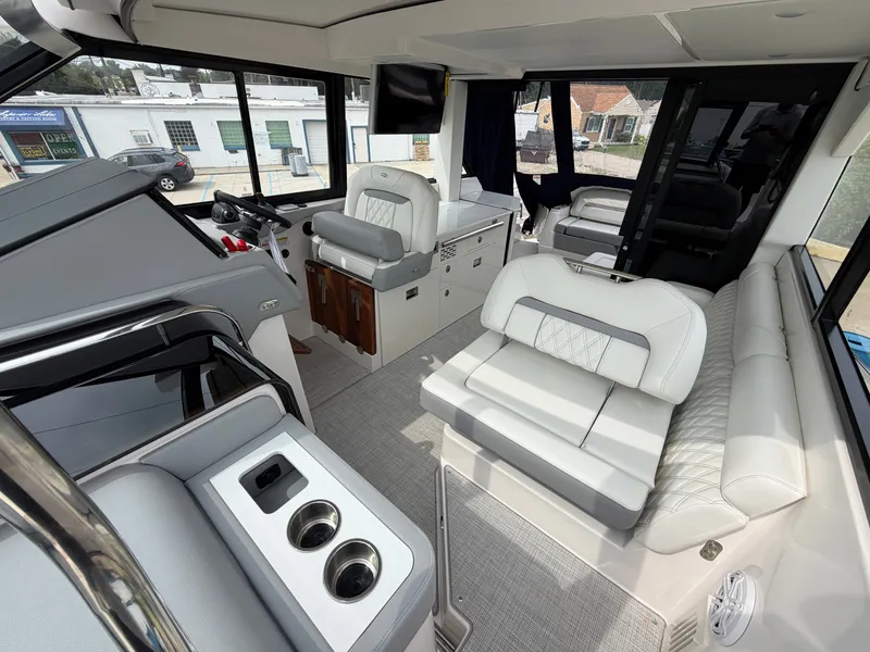 Slide: The Image of Interior of the 2027 Regal 36 Grande Coupe with sleek white seating and modern fixtures. - 21