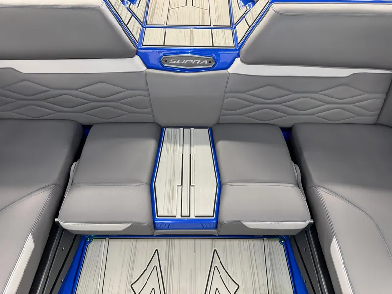 Slide: The Image of Interior of a 2025 Supra SA 450 with gray and blue upholstery. - 18