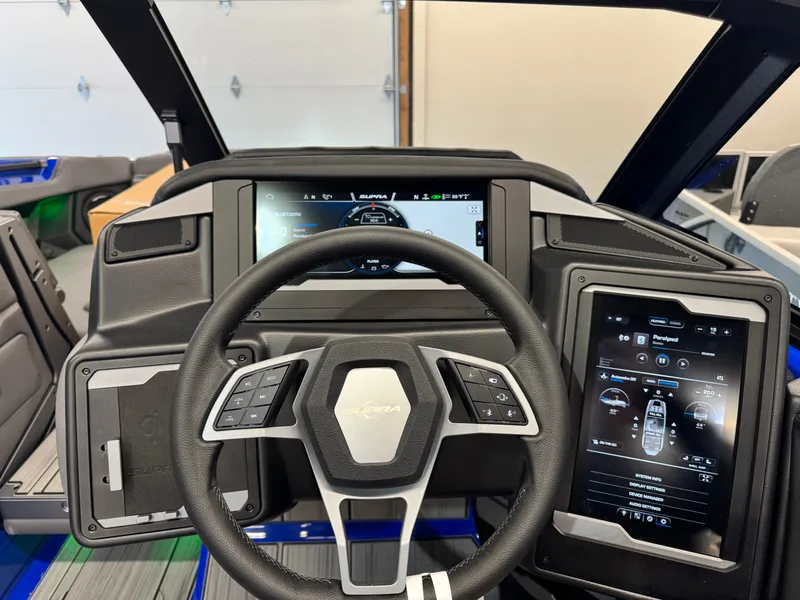 Slide: The Image of The image shows the cockpit of a 2025 Supra SA 450 with modern controls and screens. - 30