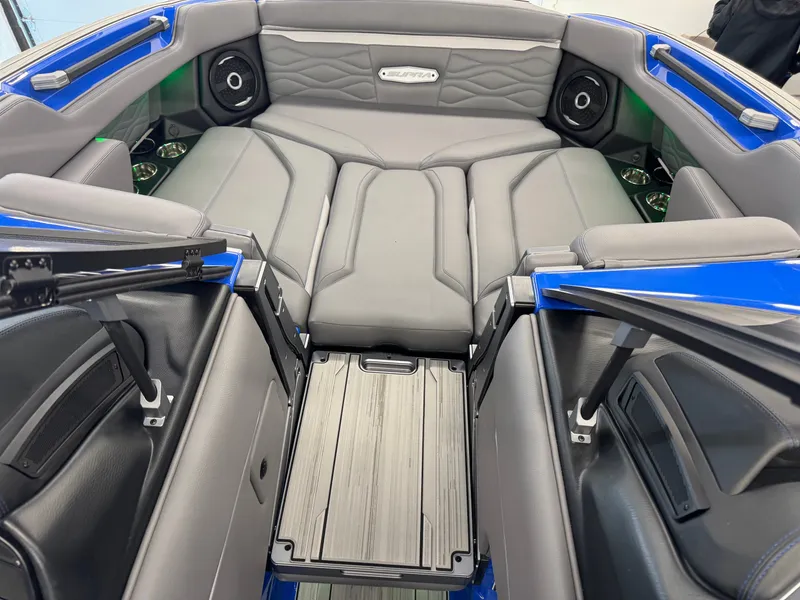 Slide: The Image of The image shows the interior of a modern boat with gray upholstery and speakers. - 22