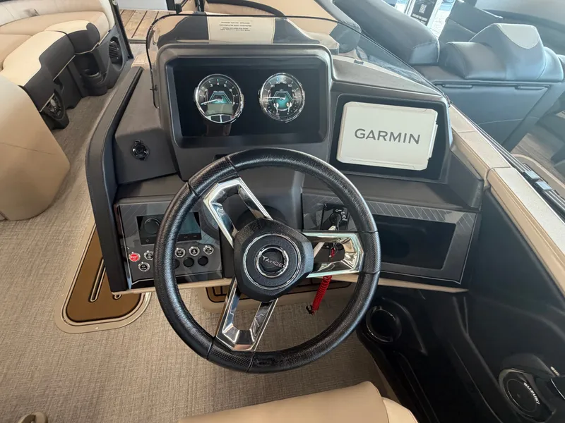 Slide: The Image of The image shows a boat's helm with a Garmin screen and two gauges. - 6