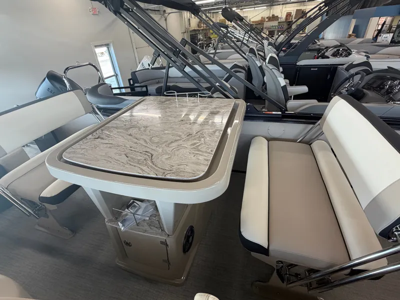Slide: The Image of The interior of a modern boat with a sleek table and comfortable bench seating. - 7