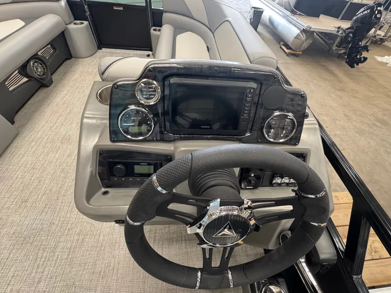 Slide: The Image of The image shows the helm of a 2025 Tahoe Sport 85 QL with modern instruments and a sleek steering wheel. - 11