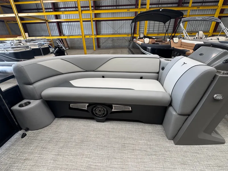 Slide: The Image of The image shows a gray and white bench seat in a modern boat, surrounded by other boats in the background. - 8