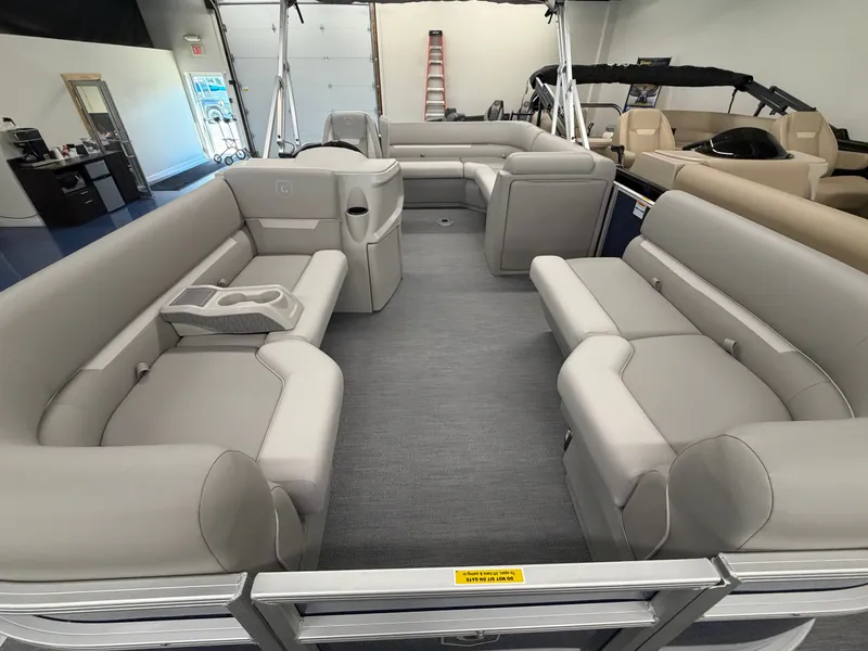 Slide: The Image of Interior view of a Godfrey EX 1880 Cruise pontoon boat with gray upholstery and seating. - 3