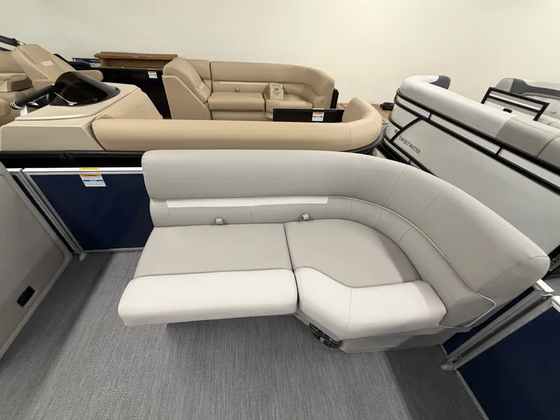 Slide: The Image of Interior of a 2027 Godfrey EX 1880 Cruise with beige and gray seating. - 6