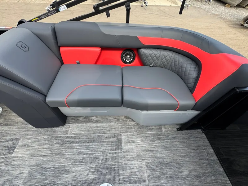 Slide: The Image of The image shows a stylish gray and red seating area on a boat with a modern design. - 10