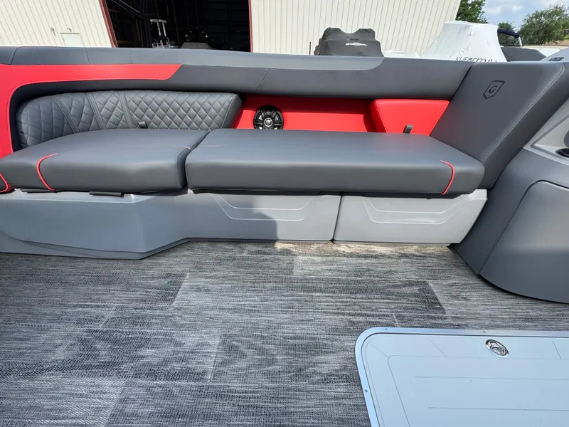 Slide: The Image of The image shows a modern boat seat with gray and red upholstery. - 4