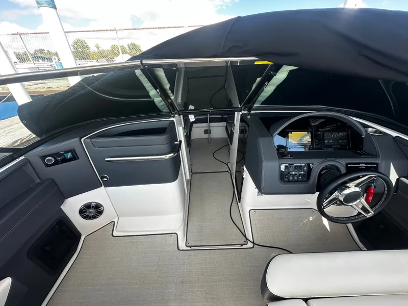 Slide: The Image of The 2023 Regal 2800 Bowrider cockpit features a modern dashboard and comfortable seating. - 20