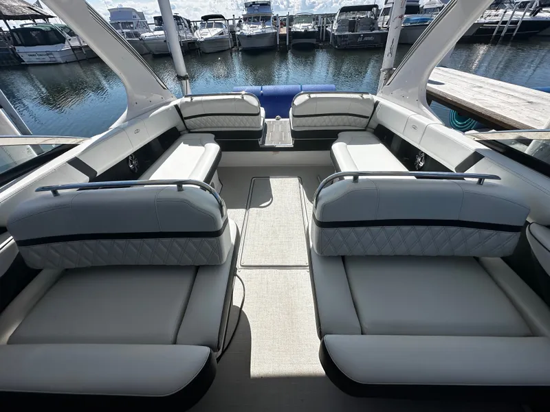 Slide: The Image of The image shows the interior of a 2023 Regal 2800 Bowrider with sleek white seating. - 17