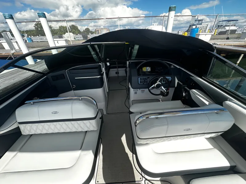 Slide: The Image of The image shows the cockpit of a 2023 Regal 2800 Bowrider with luxurious seating. - 11
