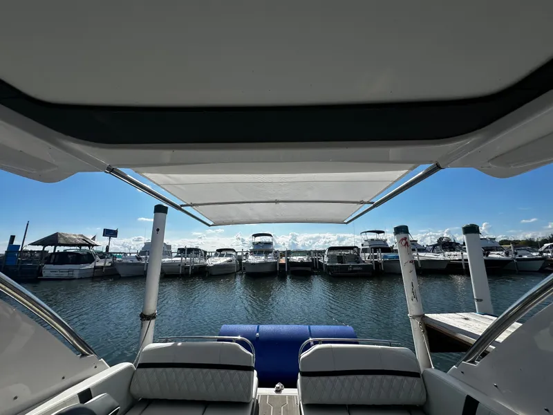 Slide: The Image of View from a Regal 2800 Bowrider overlooking a marina with several boats. - 9
