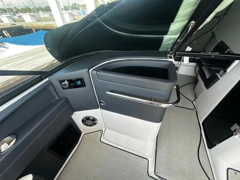 Slide: The Image of The image shows the cockpit of a 2023 Regal 2800 Bowrider with modern controls. - 21