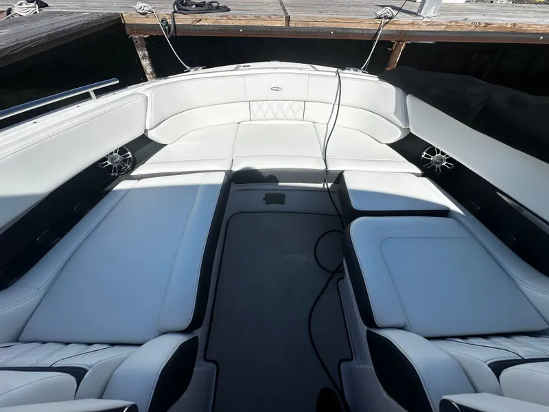 Slide: The Image of The image shows the cockpit of a 2023 Regal 2800 Bowrider with white upholstery. - 7