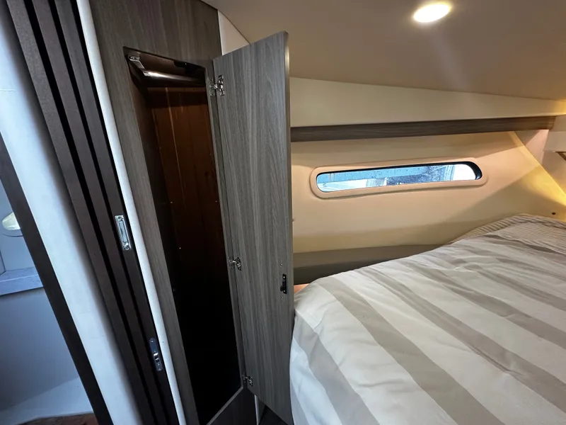 Slide: The Image of Interior of the 2022 Regal 38 Grande Coupe with bed and closet. - 16