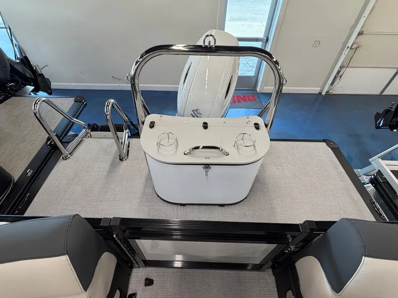 Slide: The Image of The image shows the deck of a 2026 Tahoe LTZ 2385 QL with a white helm station. - 13
