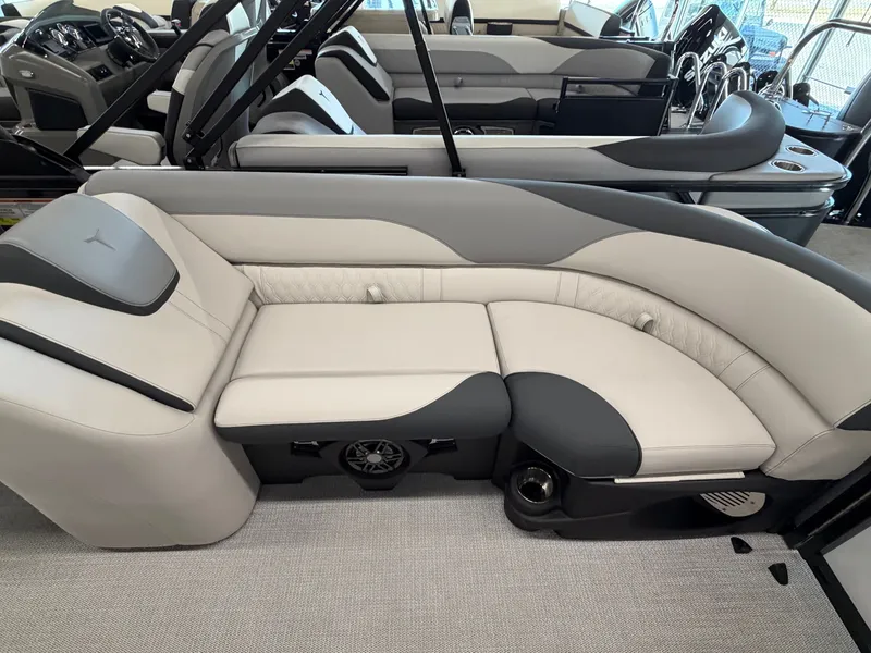 Slide: The Image of The image shows a luxurious, cushioned seating area in a modern boat, with gray and white upholstery. - 14