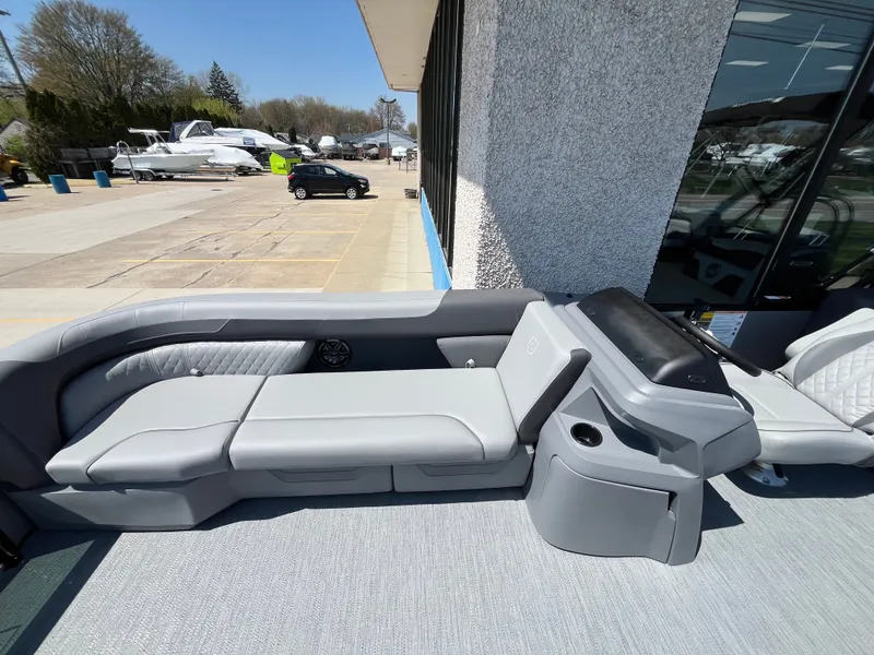 Slide: The Image of The image shows the gray seating area of a 2026 Godfrey SW 2286 SBC boat. - 4
