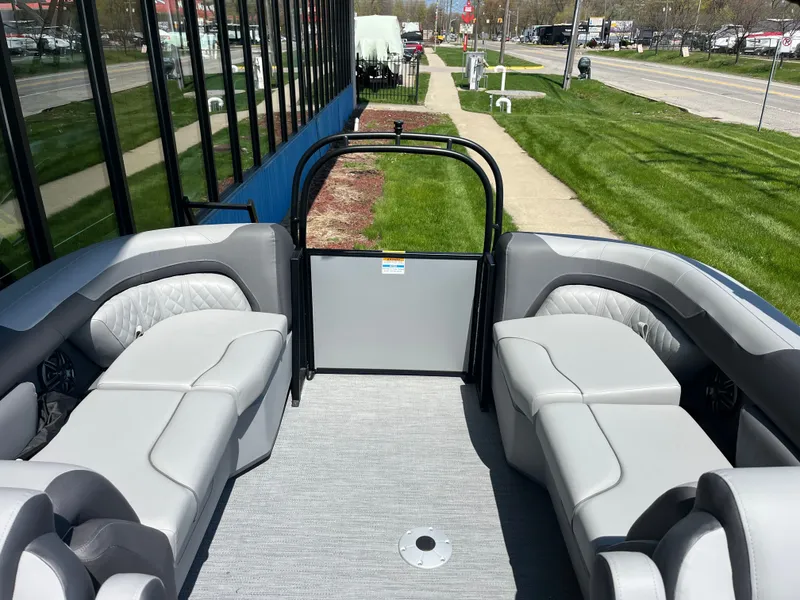 Slide: The Image of The image shows the interior of a 2026 Godfrey SW 2286 SBC boat with gray seating. - 6