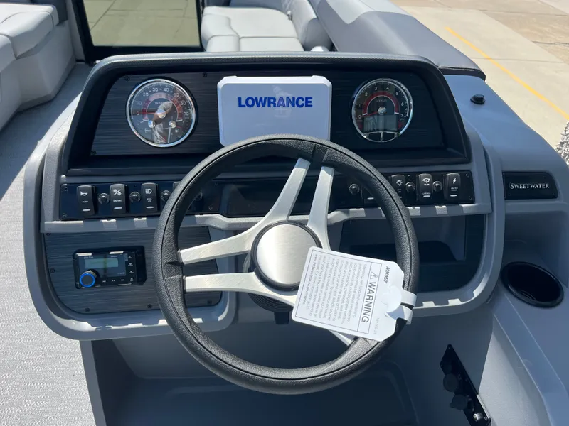 Slide: The Image of The image shows the helm of a Godfrey SW 2286 SBC boat with modern instruments. - 5