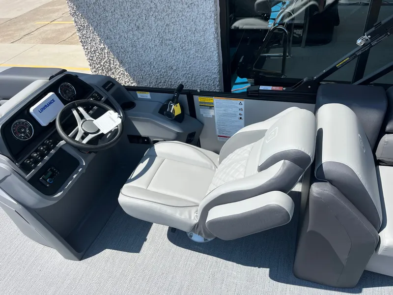 Slide: The Image of Interior view of a modern boat with gray seating and a helm featuring instruments. - 7