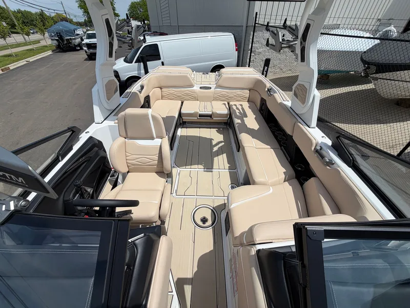 Slide: The Image of Interior view of a modern boat with beige leather seating and open deck. - 16