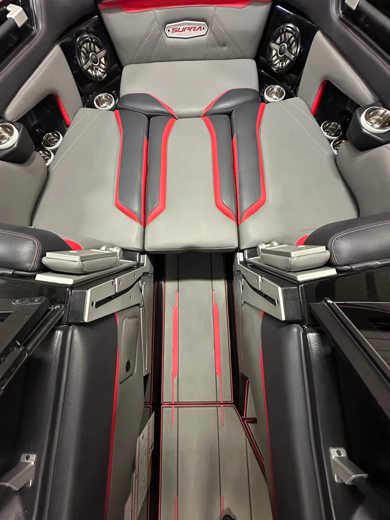 Slide: The Image of Interior of the 2022 Skiers Choice SL 550 with gray and red upholstery. - 14