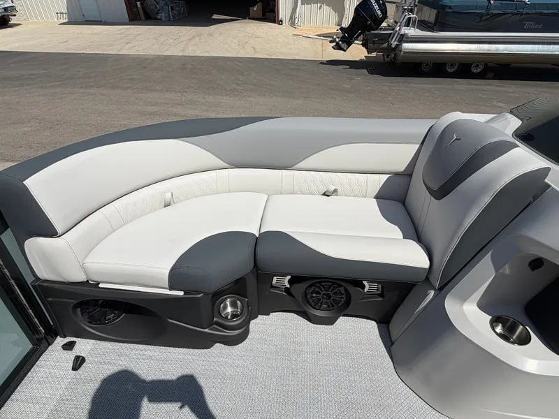 Slide: The Image of The image shows an elegant, cushioned seating area on a boat, surrounded by gray and white upholstery. - 10