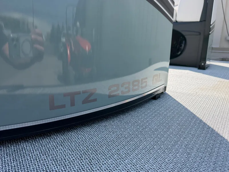 Slide: The Image of Close-up of the boat hull with "LTZ 2385 QL" lettering on a gray surface. - 2